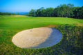 Nice golf course with bunker and nice green Royalty Free Stock Photo