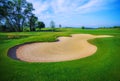 Nice golf course with bunker and nice green Royalty Free Stock Photo