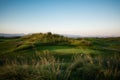 Golf course with collar at sunset Royalty Free Stock Photo