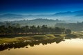Golf course at dawn backlit by rising sun Royalty Free Stock Photo