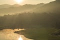 Golf course at dawn backlit by rising sun Royalty Free Stock Photo