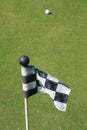 Golf Course Flag And A Golf Ball Royalty Free Stock Photo