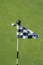 Golf Course Flag And A Golf Ball Royalty Free Stock Photo