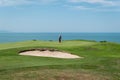 Golf course, golfer and sea Royalty Free Stock Photo