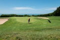 Golf course with the sea in the background Royalty Free Stock Photo