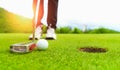 Golf course green and golf ball close in the grass field. Royalty Free Stock Photo