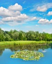 Golf course green field lake blue sky European landscape Royalty Free Stock Photo