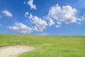 golf course - green golf field and sand pit with sky blue cloud Royalty Free Stock Photo