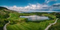 Golf course in luxury resort with players. Aerial view of golfer Royalty Free Stock Photo