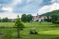 Golf course on a old church background Royalty Free Stock Photo