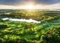 Golf course panorama at dramatic sunrise with green fairways and forest Royalty Free Stock Photo