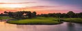 Golf course panorama at sunset with beautiful sky Royalty Free Stock Photo