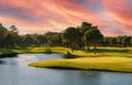 Golf course panorama at sunset with beautiful sky Royalty Free Stock Photo