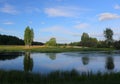 A golf course with roads, bunkers and ponds and with a lake Royalty Free Stock Photo