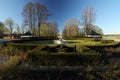 A golf course with roads and ponds and with golfcart and building in Sweden