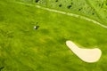 Golf course with sand bunker and green grass, aerial view Royalty Free Stock Photo