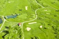 Golf course with sand bunker, green grass and pond, aerial view Royalty Free Stock Photo