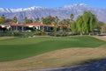 Golf Course sand traps and fairways with mountains in the background.