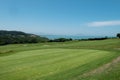 Golf course with the sea in the background Royalty Free Stock Photo