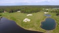 Golf course on a Sunny day, an excellent Golf club with ponds and green grass, view from the sky Royalty Free Stock Photo