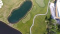 Golf course on a Sunny day, an excellent Golf club with ponds and green grass, view from the sky Royalty Free Stock Photo