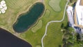 Golf course on a Sunny day, an excellent Golf club with ponds and green grass, view from the sky Royalty Free Stock Photo