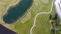 Golf course on a Sunny day, an excellent Golf club with ponds and green grass, view from the sky Royalty Free Stock Photo