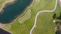 Golf course on a Sunny day, an excellent Golf club with ponds and green grass, view from the sky Royalty Free Stock Photo