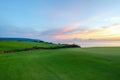 Golf course sunset overlooking the sea Royalty Free Stock Photo