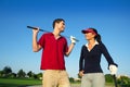 Golf course young happy couple players Royalty Free Stock Photo