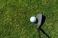 Golf detail, white golf ball on the fairway with a golf club getting ready to hit the next shot Royalty Free Stock Photo