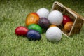 Golf Easter with golf ball and Easter eggs on green grass Royalty Free Stock Photo