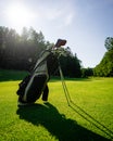 Golf equipment at the course on sunny day. Golf bag on the fairway Royalty Free Stock Photo