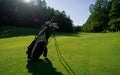 Golf equipment at the course on sunny day. Golf bag on the fairway Royalty Free Stock Photo