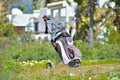 Bag of golf clubs on the golf course Royalty Free Stock Photo