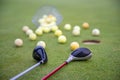 Golf equipment on green golf course, balls and sticks ready to play Royalty Free Stock Photo