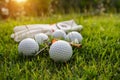 Golf equipment on green grass, ball, glove, tee and golf-club driver, golf gear and equipment on flat lay top view