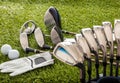 Golf equipment on green grass golf course, close up view Royalty Free Stock Photo