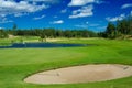 Golf fairway along a pond