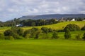 A golf fairway and in the parkland course in the Roe river valley near Limavady in Northern Ireland with the magnificent Bie