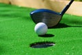 Golf field hole with cross and ball Royalty Free Stock Photo