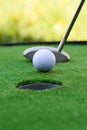 Golf field hole with cross and ball Royalty Free Stock Photo