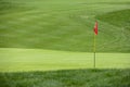 Golf flag on the green grass Royalty Free Stock Photo