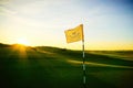 Golf course flag early morning. Royalty Free Stock Photo