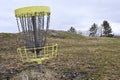 golf frisbee basket in early spring
