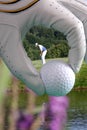 Golf glove with ball and with golfer Royalty Free Stock Photo