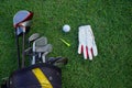 Golf glove , white golf ball and tee put on green grass of golf course ,This golf objects for play Royalty Free Stock Photo