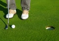 Golf green hole course man putting short ball Royalty Free Stock Photo