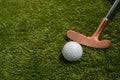golf mallet on the green, artificial turf Royalty Free Stock Photo