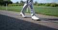 Golf man legs walking at course. Luxury man going at summer golfing country club Royalty Free Stock Photo